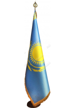 Flag of Kazakhstan with a fringe on a stand with a tip