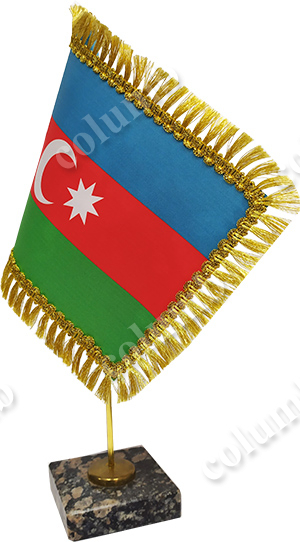 Flag of Azerbaijan with a fringe on a stand with a granite base